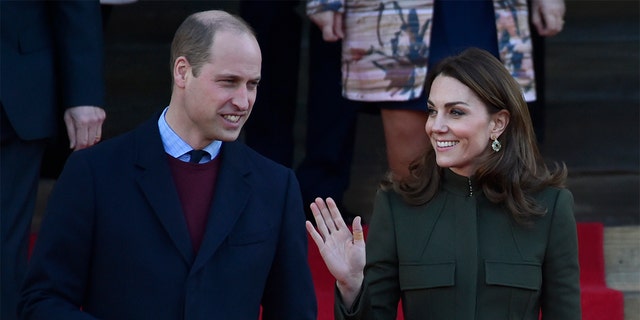 Britain's Prince William, left, smiles as Kate Duchess of Cambridge waves to the crowd after their meeting with the members of the public at Centenary Square in Bradford northern England, Wednesday, Jan. 15, 2020. 