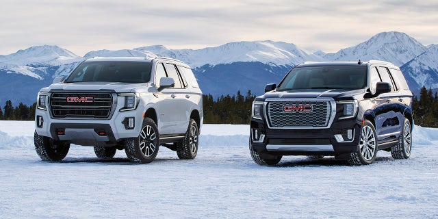 (L to R) 2021 GMC Yukon AT4 and Denali