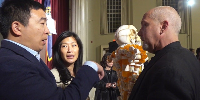 Huntley discusses the opioid crisis with Democratic presidential candidate Andrew Yang and wife Evelyn at a campaign stop last week in Peterborough, N.H.