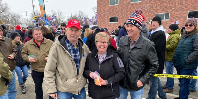 Trump supporter Scott Whiton of Perry, Iowa [on the left) waits in line to enter the president's rally in Des Moines, Iowa, on Jan. 30, 2020