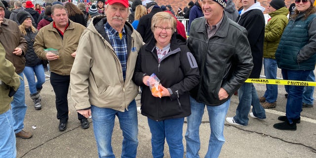 Trump supporter Scott Whiton of Perry, Iowa (on the left) waits in line to enter the president's rally in Des Moines, Iowa, on Jan. 30, 2020