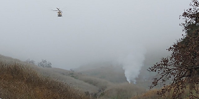 A helicopter crashed and sparked a small brush fire Sunday in Southern California, officials said.