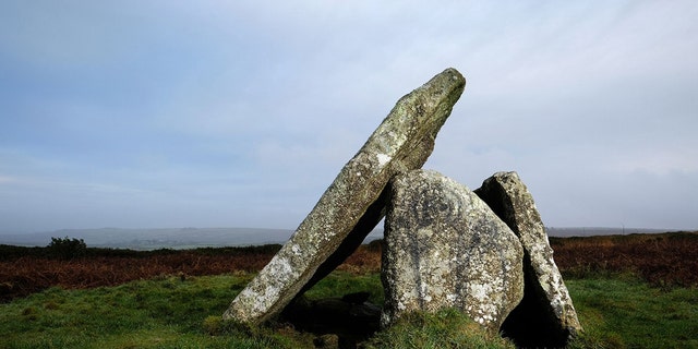 Graffiti which is thought to depict two alien figures has appeared on the ancient site of Mulfra Quoit in West Cornwalll. Vandals have caused fury by painting two ALIENS on stones at an ancient site. (Credit: SWNS)