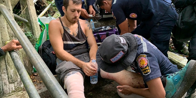 Grasser was treated for minor injuries after being rescued from the edge of a cliff. (Phatthalung Rescue Organization via AP)