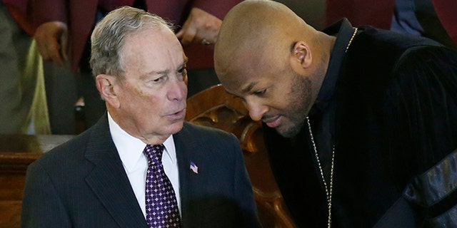 Democratic Presidential candidate Michael Bloomberg, left, talks with the Rev. Robert Turner, right, during a service at the Vernon American Methodist Episcopal Church in Tulsa, Okla., Sunday, Jan. 19, 2020. (AP Photo/Sue Ogrocki)