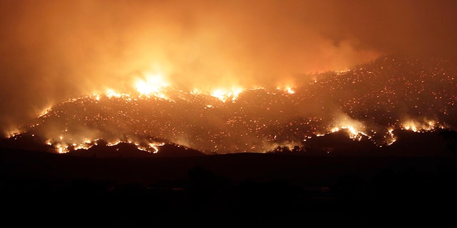 A blaze on Canberra's southern fringe that has razed more than 53,000 acres since it was sparked by heat from a military helicopter landing light on Monday, 官员说.