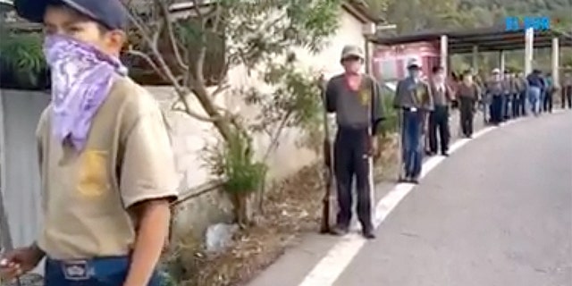The boys are being trained to defend Chilapa from gangs, a group says.