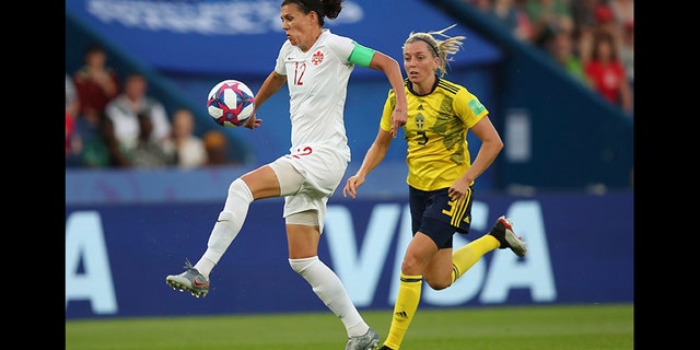 Canada's Christine Sinclair, left, is chased down by Sweden's Linda Sembrant during a Women's World Cup round of 16 soccer match in Paris, France, in June 2019.
