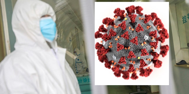 Medical workers in protective gear stand as a woman suspected of being ill with coronavirus waits to be seen at a community health station in Wuhan in central China's Hubei Province, Monday, Jan. 27, 2020.