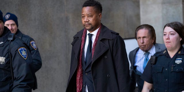 Cuba Gooding Jr. leaves court, Wednesday, Jan. 22, 2020, in New York. A New York City judge ruled that two additional women accusing Gooding of sexual misconduct will be allowed to testify at the "Jerry Maguire" actor's trial on charges he groped women at Manhattan bars in October 2018 and June 2019.