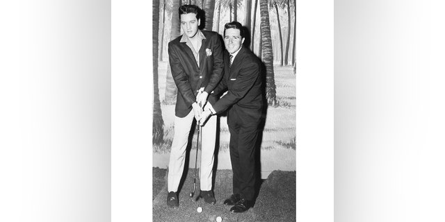 Elvis, seen here with Masters champion Gary Player, was not a big golfer.
