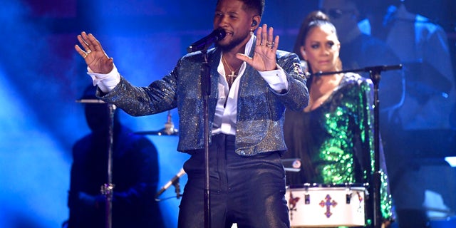 Usher performs onstage during the 62nd Annual Grammy Awards in a musical tribute to Prince.