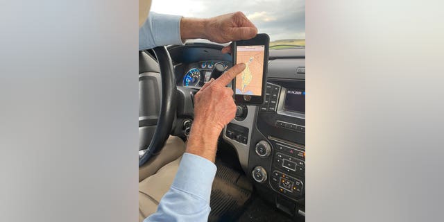 Farmer Murray Campbell shows the technology used to maintain and monitor water usage.