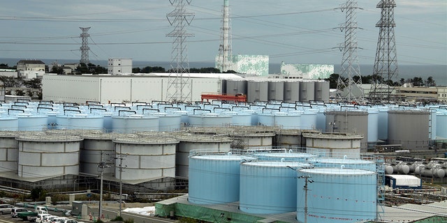 An ever-growing amount of contaminated, treated but still slightly radioactive, water at the wrecked Fukushima Dai-ichi nuclear plant is stored in about 900 huge tanks, including those seen in this photo taken during a plant tour in 2017. (AP)