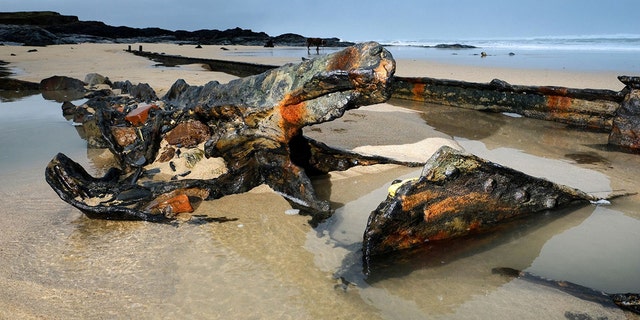A First World War German shipwreck has been uncovered by recent storms at a Cornish beach more than a century after it became stranded on a reef while being towed by the Royal Navy. (Credit: SWNS)