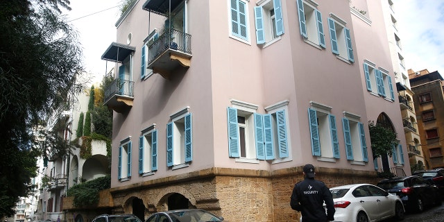 A private security guard stood outside the house of ex-Nissan chief Carlos Ghosn in Beirut, Lebanon, on Sunday. (AP Photo/Hussein Malla)