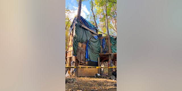 Cleanup crews tore down a massive three-story makeshift shelter built in the Sepulveda Basin on Thursday as cleanup crews entered the final phase of a four-part operation to rid the area of the many homeless encampments.