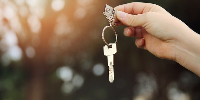 FILE - A person is seen holding a house key.