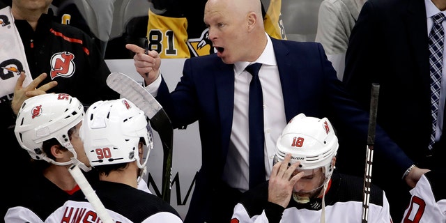 In this Jan. 28, 2019, file photo, then-New Jersey Devils head coach John Hynes gives instructions during the first period of an NHL hockey game against the Pittsburgh Penguins in Pittsburgh.  (AP Photo/Gene J. Puskar, File)