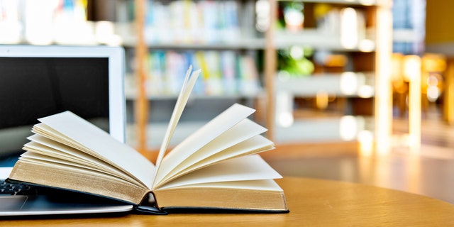 book open on a library table