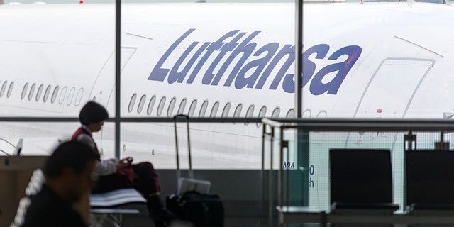 Lufthansa Airbus A340 airplane through a window at Frankfurt Airport on May 2, 2018, in Germany.