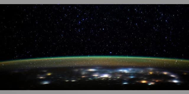 The sparkling lights of Earth are seen in this image released by NASA.