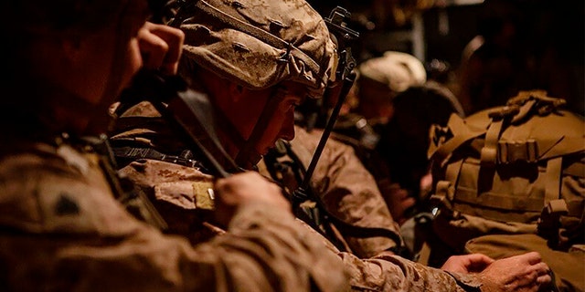 In this photo provided by U.S. Department of Defense, U.S. Marines prepare to deploy from Kuwait on Dec. 31. (AP/U.S. Marine Corps/Sgt. Robert G. Gavaldon)