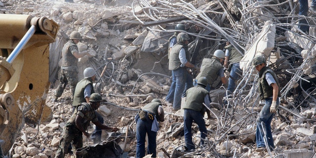 U.S. Marines search for survivors and bodies in the rubble -- all that was left of their barracks in Beirut -- after a suicide car bomb was driven into the building and detonated in 1983, killing 241 U.S. service members and wounding over 60. 