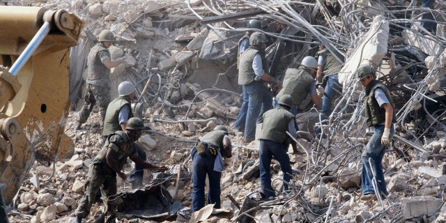 U.S. Marines search for survivors and bodies in the rubble – all that was left of their barracks in Beirut – after a suicide car bomb was driven into the building and detonated in 1983, killing 241 U.S. service members and wounding over 60.