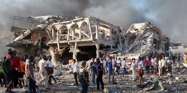 Somalis gather and search for survivors following a deadly truck bombing in Mogadishu, in October 2017. (AP)