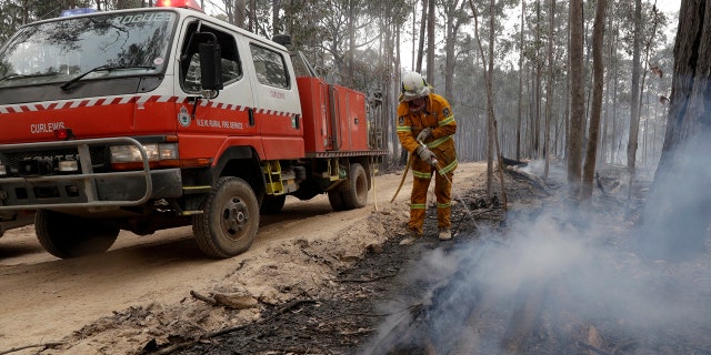 Authorities are using relatively benign conditions forecast in southeast Australia for a week or more to consolidate containment lines around scores of fires that are likely to burn for weeks without heavy rainfall. (AP Photo/Rick Rycroft)