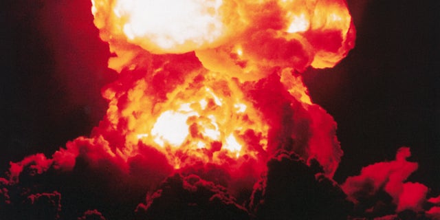 The detonation of the atomic bomb nicknamed "Smokey," as part of Operation PLUMBBOB in the Nevada desert. 1957.