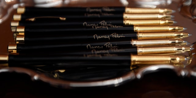 The pens that House Speaker Nancy Pelosi of Calif., will use to sign the resolution to transmit the two articles of impeachment against President Trump to the Senate for trial. (AP Photo/Susan Walsh)