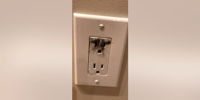 A scorch mark is seen on an electrical outlet after an "outlet challenge" incident. (Massachusetts Fire Marshal)