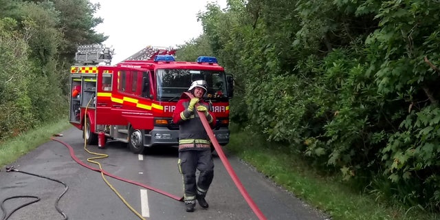 Adam Martin doing his job as a firefighter.