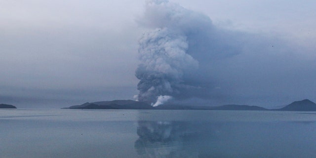 Taal volcano spews ash in a view from Batangas, southern Philippines on Monday, Jan. 13, 2020.