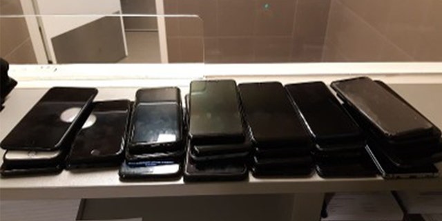 The stacks of phones were found inside the suspect's cycling shorts, Dutch police say.