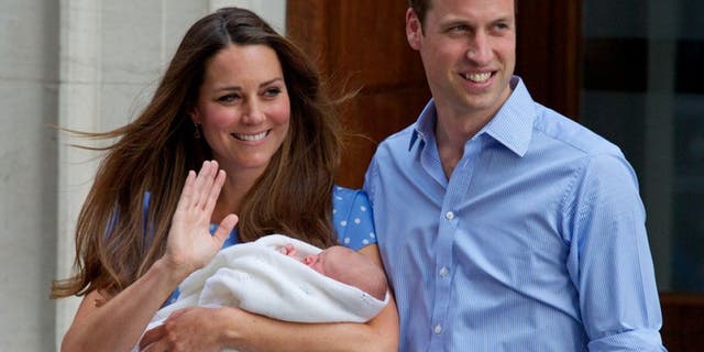 Prince William and Kate Middleton show their new-born baby boy, Prince George, on July 23, 2013, in London.