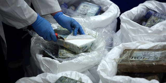 A large supply of recently seized cocaine was displayed to the press at the Portuguese police headquarters in Lisbon on Wednesday. (AP Photo/Armando Franca)