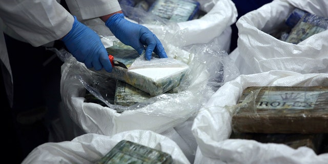 A large supply of recently seized cocaine was displayed to the press at the Portuguese police headquarters in Lisbon on Wednesday. (AP Photo/Armando Franca)