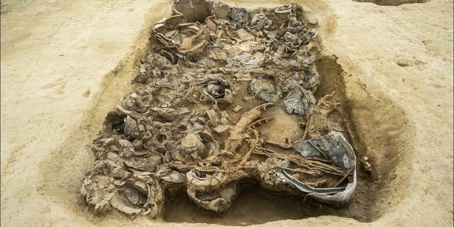 The rich assemblage of grave goods indicates that the person buried here held a high status. (Credit: Pierluigi Giorgi, copyright Antiquity Publications Ltd.)