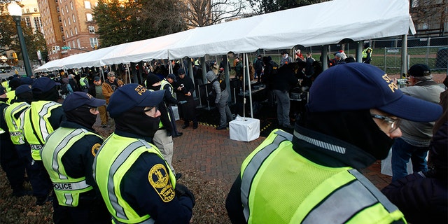 Virginia's Capitol flooded with gun rights activists for Second Amendment rally 2 Virginia State troopers stand near a security checkpoint at the Capitol grounds in Richmond. (AP)