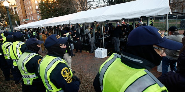 Virginia State troopers stand near a security checkpoint at the Capitol grounds in Richmond. (AP)