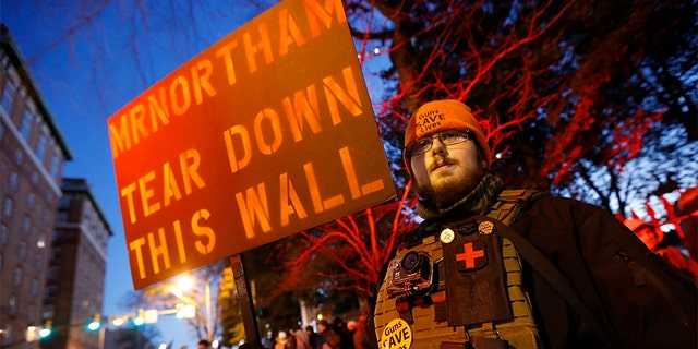 A pro-gun demonstrator holds a sign outside the Virginia Statehouse prior to a gun-rights rally in Richmond, Jan. 20, 2020. (Associated Press)