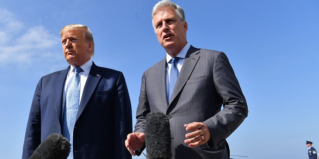 US President Donald Trump(L)speaks next to new national security advisor Robert O'Brien on September 18, 2019 at Los Angeles International Airport in Los Angeles, California. (Photo by Nicholas Kamm / AFP via Getty Images)