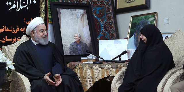 Iranian President Hassan Rouhani, left, meets family of Iranian Revolutionary Guard Gen. Qassem Soleimani, who was killed in the U.S. airstrike in Iraq, at his home in Tehran, Iran, on Saturday.