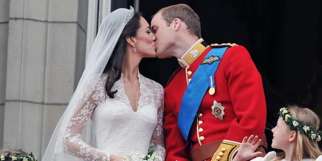 Kate Middleton and Prince William share a kiss on their wedding day at Westminster Abbey on April 29, 2011.