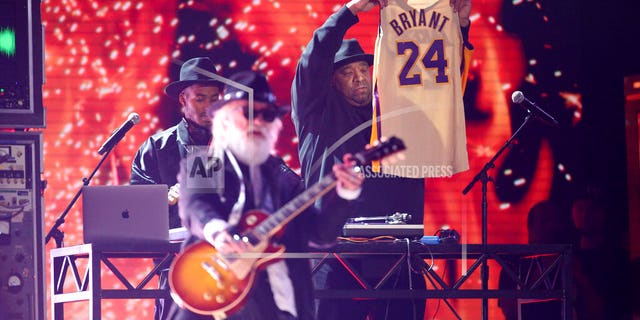 Joseph Simmons holds a jersey of the late Kobe Bryant at the 62nd annual Grammy Awards on Sunday, Jan. 26, 2020, in Los Angeles.