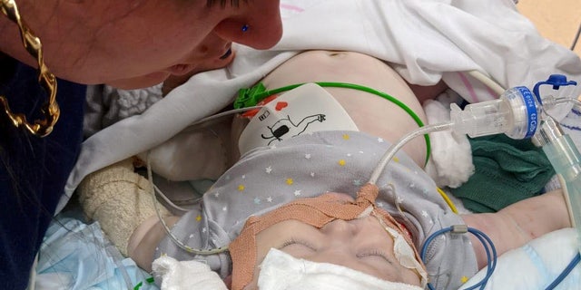 Laura Cooke in the hospital with critically ill Luchii Gavrilescu.