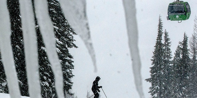 FILE - In this Feb. 25, 2013 file photo, a skier takes advantage of the snowy conditions at Silver Mountain in Kellogg, Idaho. The Shoshone County Sheriff's Office said Tuesday, Jan. 7, 2020, it received reports of up to three separate avalanches on the mountain and that emergency responders were coordinating rescue efforts. (Kathy Plonka/The Spokesman-Review via AP)